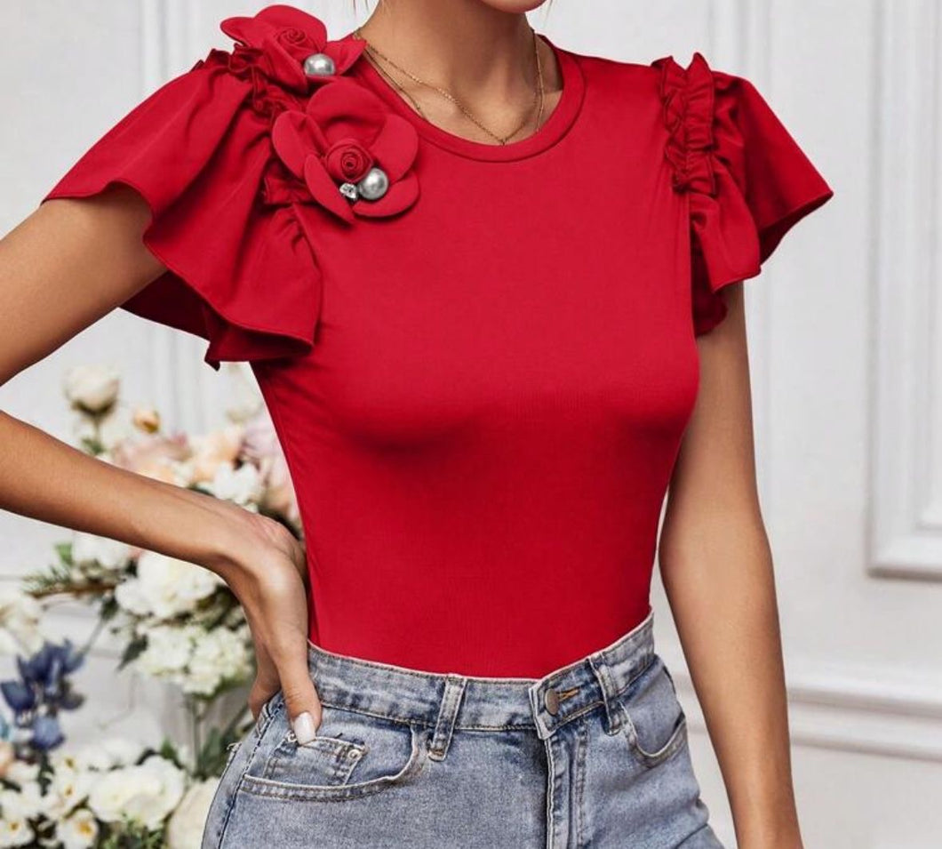 BLUSA ROJA CON FLOR Y PERLA