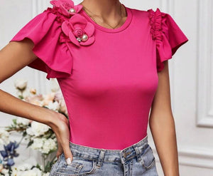 BLUSA ROSADA CON FLOR Y PERLA